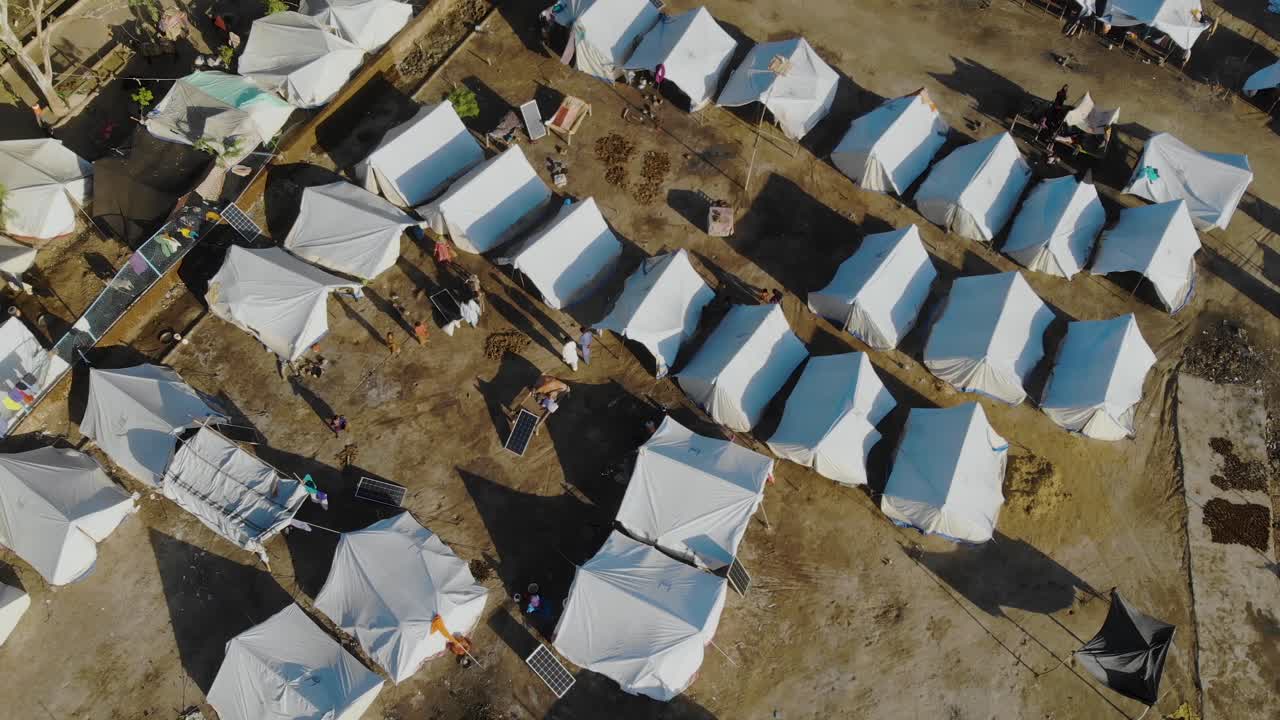 Premium Stock Video Aerial Top Down View Of Makeshift Camps For Flood