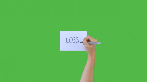Woman-Writing-Loss-on-Paper-with-Green-Screen