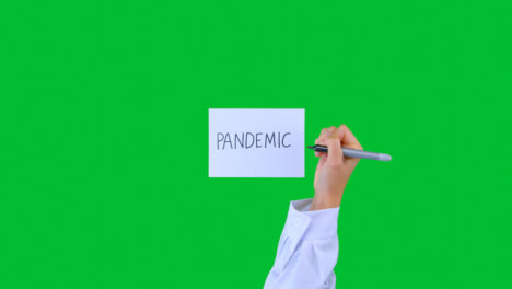 Arzt-Schreibt-Pandemie-Auf-Papier-Mit-Grünem-Bildschirm