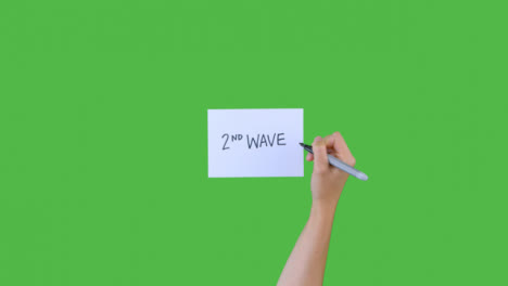 Woman-Writing-2nd-Wave-on-Paper-with-Green-Screen