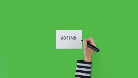 Mujer-Escribiendo-Votando-En-Papel-Con-Pantalla-Verde