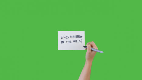 Woman-Writing-Who-is-Winning-in-the-Polls-with-Green-Screen