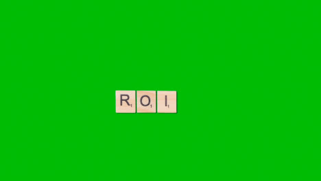 Stop-Motion-Business-Concept-Overhead-Shot-Wooden-Letter-Tiles-Forming-Acronym-ROI-On-Green-Screen-1