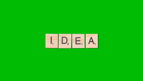 Stop-Motion-Business-Concept-Overhead-Wooden-Letter-Tiles-Forming-Word-Idea-On-Green-Screen-1