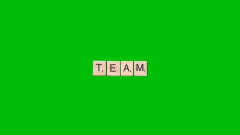 Stop-Motion-Business-Concept-Overhead-Wooden-Letter-Tiles-Forming-Word-Team-On-Green-Screen