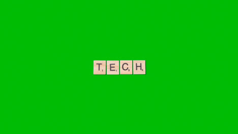 Stop-Motion-Business-Concept-Overhead-Wooden-Letter-Tiles-Forming-Word-Tech-On-Green-Screen
