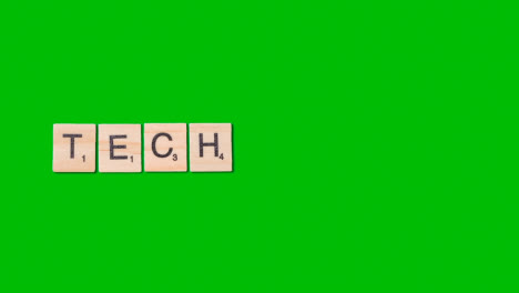 Stop-Motion-Geschäftskonzept-Overhead-Holzbuchstabenfliesen,-Die-Wort-Tech-Auf-Green-Screen-1-Bilden