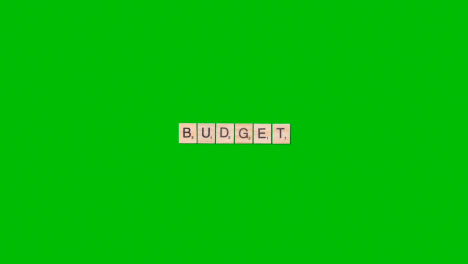 Stop-Motion-Business-Concept-Overhead-Wooden-Letter-Tiles-Forming-Word-Budget-On-Green-Screen