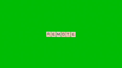 Stop-Motion-Business-Concept-Overhead-Wooden-Letter-Tiles-Forming-Word-Remote-On-Green-Screen