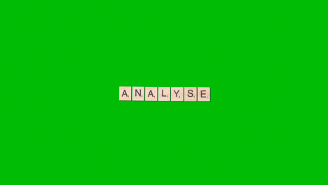 Stop-Motion-Business-Concept-Overhead-Wooden-Letter-Tiles-Forming-Word-Analyse-On-Green-Screen