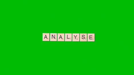 Stop-Motion-Business-Concept-Overhead-Wooden-Letter-Tiles-Forming-Word-Analyse-On-Green-Screen-1