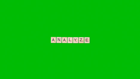 Stop-Motion-Business-Concept-Overhead-Wooden-Letter-Tiles-Forming-Word-Analyse-On-Green-Screen