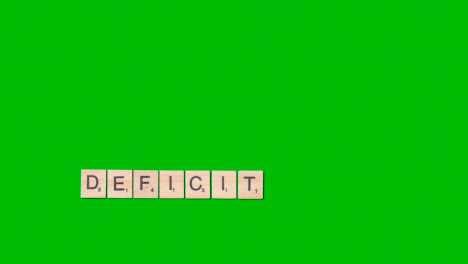 Stop-Motion-Business-Concept-Overhead-Wooden-Letter-Tiles-Forming-Word-Deficit-On-Green-Screen-1