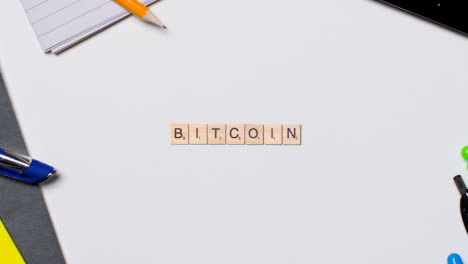 Stop-Motion-Business-Concept-Overhead-Wooden-Letter-Tiles-Forming-Word-Bitcoin-On-Green-Screen
