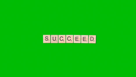 Stop-Motion-Business-Concept-Overhead-Wooden-Letter-Tiles-Forming-Word-Succeed-On-Green-Screen-1