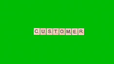 Stop-Motion-Business-Concept-Overhead-Wooden-Letter-Tiles-Forming-Word-Customer-On-Green-Screen-1