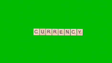 Stop-Motion-Business-Concept-Overhead-Wooden-Letter-Tiles-Forming-Word-Currency-On-Green-Screen-1