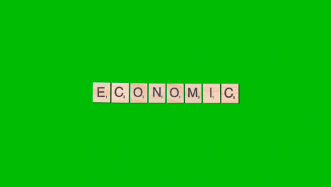 Stop-Motion-Geschäftskonzept-Overhead-Holzbuchstabenfliesen,-Die-Wort-Wirtschaftlich-Auf-Grünem-Bildschirm-Bilden-1