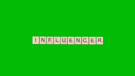 Stop-Motion-Business-Concept-Overhead-Wooden-Letter-Tiles-Forming-Word-Influencer-On-Green-Screen-1