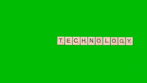 Stop-Motion-Business-Concept-Overhead-Wooden-Letter-Tiles-Forming-Word-Technology-On-Green-Screen-1