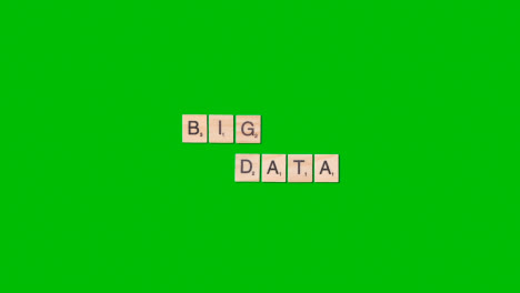 Stop-Motion-Business-Concept-Overhead-Wooden-Letter-Tiles-Forming-Words-Big-Data-On-Green-Screen