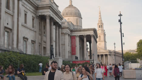 Trafalgar-Square-With-National-Gallery-And-St-Martin-In-The-Fields-Church-With-Tourists-In-London-England-UK