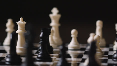 Studio-Shot-Chess-Board-And-Pieces-Set-Up-For-Game-With-Player-Taking-White-Rook