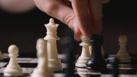 Studio-Shot-Chess-Board-And-Pieces-Set-Up-For-Game-With-Player-Taking-Black-Rook-1