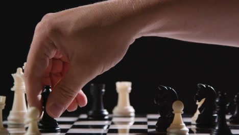 Studio-Shot-Chess-Board-And-Pieces-Set-Up-For-Game-With-Black-Bishop-Taking-White-King