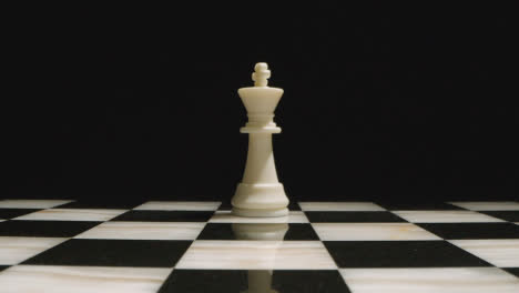 Studio-Shot-Of-Chess-Board-Empty-Apart-From-White-King-Piece