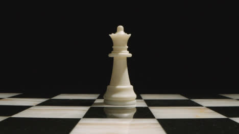 Studio-Shot-Of-Chess-Board-Empty-Apart-From-White-Queen-Piece