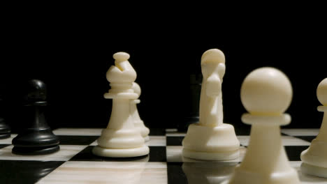 Studio-Shot-Chess-Board-And-Pieces-Set-Up-For-Game-With-Black-Rook-Taking-White-Knight