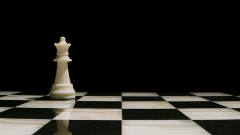 Studio-Shot-Of-Chess-Board-Empty-Apart-From-White-Queen-Piece-1