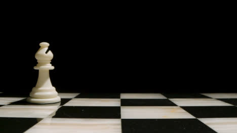 Studio-Shot-Of-Chess-Board-Empty-Apart-From-White-Bishop-Piece