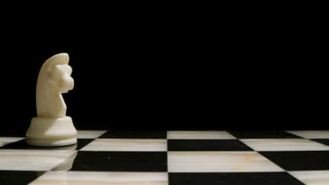 Studio-Shot-Of-Chess-Board-Empty-Apart-From-White-Knight-Piece