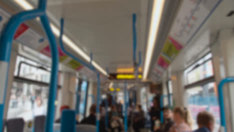 Defocused-Interior-View-Of-Tram-With-Passengers-In-Birmingham-UK