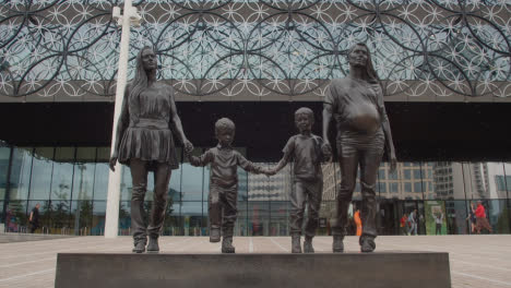 Exterior-Of-Modern-Building-And-Statue-Of-Family-In-Centenary-Square-In-Birmingham-UK-3