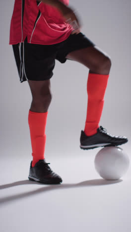 Vertical-Video-Of-Male-Footballer-Wearing-Club-Kit-Controlling-Ball-And-Dribbling-1