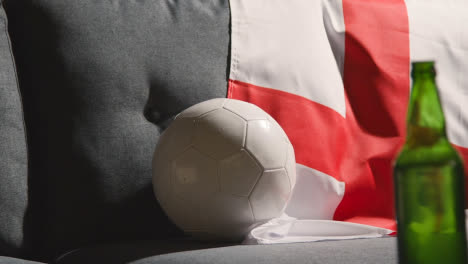 Sofa-In-Lounge-With-English-Flag-And-Ball-As-Fans-Prepare-To-Watch-Football-Soccer-Match-On-TV-2