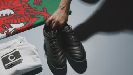 Studio-Still-Life-Shot-Of-Football-Soccer-Boots-Welsh-Flag-Shirt-And-Shorts-And-Captains-Armband-1