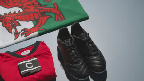 Studio-Still-Life-Shot-Of-Football-Soccer-Boots-Welsh-Flag-Shirt-And-Shorts-And-Captains-Armband-2