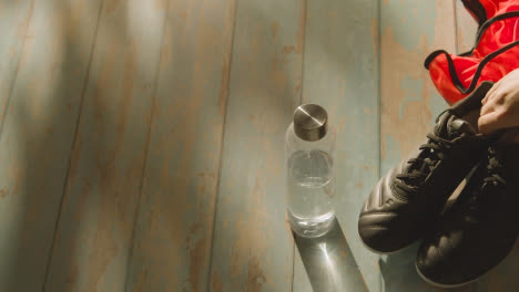 Studio-Still-Life-Shot-Of-Football-Soccer-With-Boots-Ball-And-Training-Bib-In-Dressing-Room-1