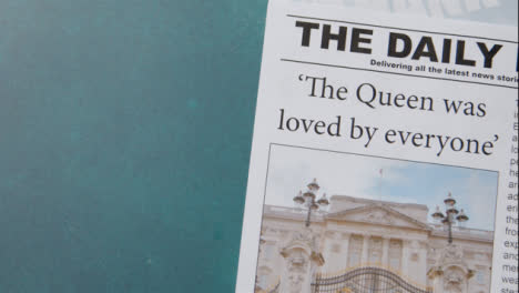 Tracking-Shot-of-Queen-Elizabeth-Death-Newspaper-Headlines-with-Copy-Space-06