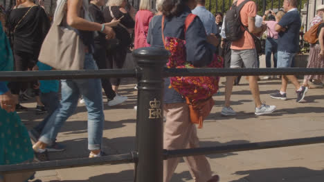 Medium-Shot-of-Walking-Crowds-Outside-of-Buckingham-Palace
