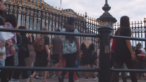 Low-Angle-Shot-of-Crowd-of-People-Outside-of-Buckingham-Palace