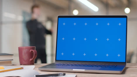 Blue-Screen-Laptop-on-Desk-In-University-College-Or-School-1