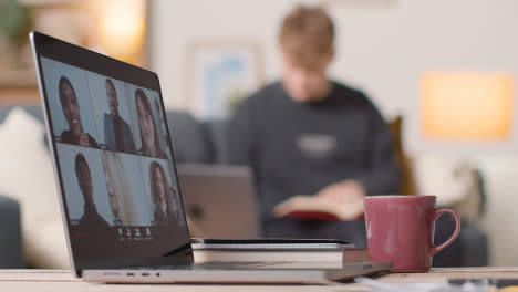 Man-Joining-Virtual-Video-Business-Meeting-On-Laptop-At-Home-1