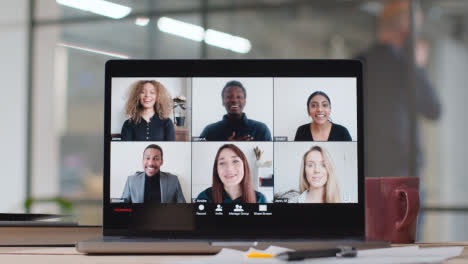 Screen-Showing-Virtual-Video-Business-Meeting-On-Laptop-In-Modern-Office