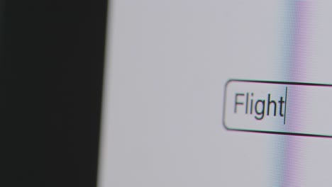 Close-Up-Of-Screen-With-Person-Typing-Flight-Cancellation-Compensation-Into-Computer-Search-Engine-1