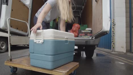 Loading-Bay-Of-UK-Food-Bank-Building-With-Food-Being-Loaded-Into-Vans-8